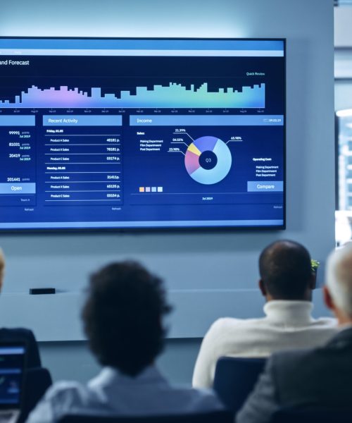 Presentation Event: Black Businesswoman Talks about e-Commerce Product Showing TV with Big Data Statistics, Charts, Revenue Growth Infographics. Press Conference for Digital Entrepreneurs.